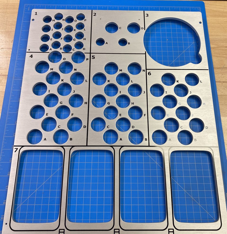 Machined aluminium panel with silk-screened alphanumeric location markings